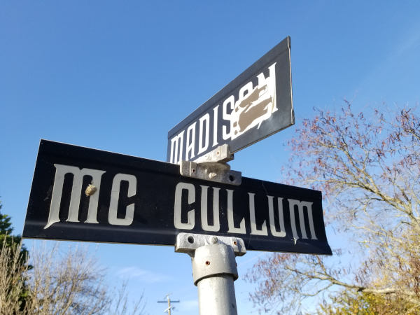 Street sign with distinct font at intersection